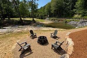Take a short downhill walk to reach the wood-burning fire pit at the water's edge, where you can relax under the stars!