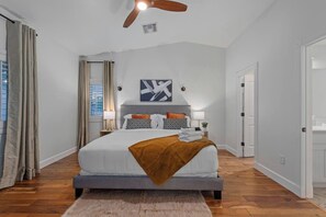 Primary Bedroom with a king size bed and it's own smart television