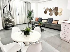Open concept of the living room and kitchen makes it easy for everyone to chat.