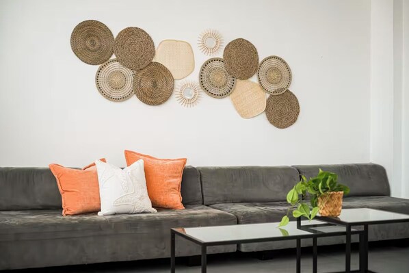 Long, comfy sofa easily fits everyone. Living room accommodates air mattresses.