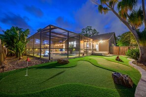 Welcome to your backyard paradise — beautifully lit for evening enjoyment! Play a round of putt-putt under the stars and enjoy more games long after the sun goes down.

