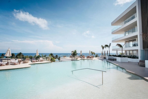 Imagine starting your day right here—sun shining, pool glistening, and the ocean just beyond. ONE Mambo is giving total vacation vibes, and yes… you definitely deserve this.