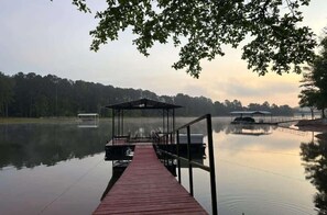 Step onto your private dock and breathe in the stillness of the water. Whether you're casting a line, tying up the boat, or watching the sunset paint the lake, this peaceful retreat is where unforgettable and magical moments begin.
