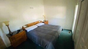 Wake up refreshed in this inviting bedroom, designed for comfort after a day on the lake.