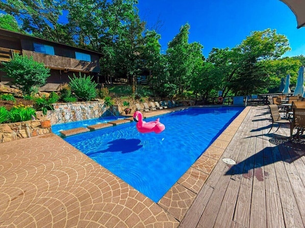 Soak up the sun at this stunning lakefront pool in Treetop Village, located in the iconic Four Seasons community at Lake of the Ozarks. Surrounded by trees and overlooking the sparkling lake, this serene pool area is the perfect place to unwind, swim, and take in the breathtaking views. Guests staying in Treetop Village enjoy exclusive access to this scenic pool, just steps fro...