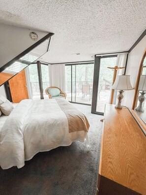 Surrounded by serenity—this bedroom brings the calm of the forest indoors.