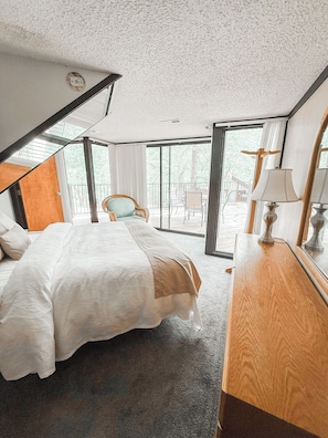 Surrounded by serenity—this bedroom brings the calm of the forest indoors.
