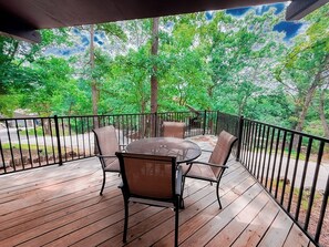 Soak in the sights and sounds of nature from this elevated outdoor space—deck living at its best!