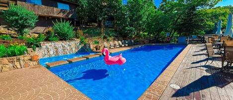 Soak up the sun and lake views! Guests at Treetop Villas enjoy access to two beautiful lakefront pools — the perfect spot to relax, swim, and float the day away.