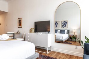 Clean lines and textural calm. Mid-century nightstands, ceramic lamps, and soft charcoal pillows set the tone for restorative rest. #LoftDetails #StudioInterior #AirbnbDesign #StratfordStay #BotanicalLoft #TexturalInspo #SleepSanctuary