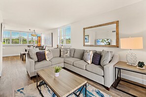 The open, airy living room is filled with natural light—great for relaxing or gathering with loved ones.