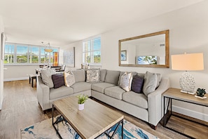 The open, airy living room is filled with natural light—great for relaxing or gathering with loved ones.