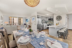 Comfortable seating and a seamless flow into the kitchen and dining area make this a perfect shared space.