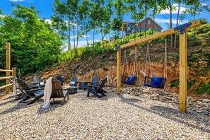 Outdoor firepit and swings to enjoy the views!