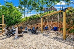 Outdoor firepit and swings to enjoy the views!