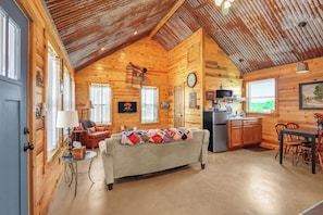 Entry view to left when entering the cabin. The cabin has 2 bedrooms, 1 bath, and a small kitchenette.