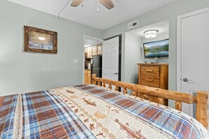 Bedroom with king bed balcony access and TV (sleeps 2)
