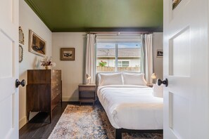 Nature-Inspired Comfort – Unwind in a tranquil, greenery-toned space with luxe linens and natural light.