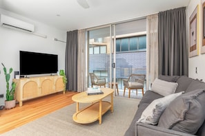 In the living area, settle in for a cosy night with your favourite shows on the TV, and enjoy year-round comfort thanks to split-system air conditioning and heating, perfect for relaxing after a day in the city.