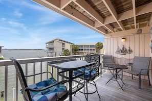 Private deck with seating and dining room