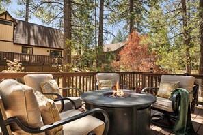 As dusk settles, the inviting glow of the firepit sets the scene for an unforgettable evening.