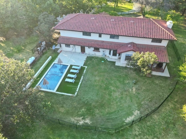 Go swimming in the pool with sun loungers and umbrellas.