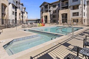 Large heated pool and hot tub only steps to covered building door