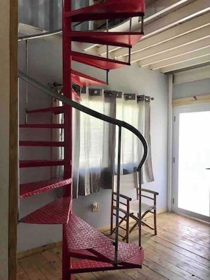These stairs take you to the master bedroom and bathroom; access to 2 terraces where you can see the beach, Estatua Colón & beautiful sunrise and sunsets.