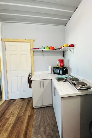 Our kitchen is fully equipped with small stove, pots & pans, utensils, dinnerware, coffee pot, fridge and everything you need to cook up some fun!