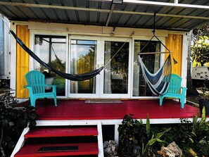 Porch with hammocks and beach chairs to enjoy with good company. 