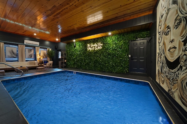 Boho inspired indoor pool space with Dolly Parton Mural