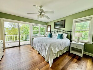 Upper level primary bedroom with king bed and en-suite toilet