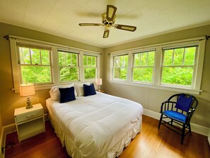 Main level queen bedroom with plenty of natural light and en-suite full bath