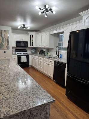 Fully stocked kitchen with coffee and tea station, toaster, blender and more!