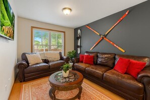 Charming and compact living room made for relaxing evenings.- Unit B

