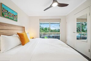 Bushland views from the queen bed in the first bedroom—let the greenery greet you with every sunrise.
