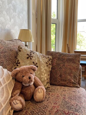 cosy bear on sofa bed