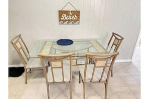 Enjoy meals, games or quiet mornings at this inviting coastal dining space.