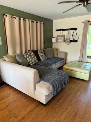 Living room with couch covers for dogs.