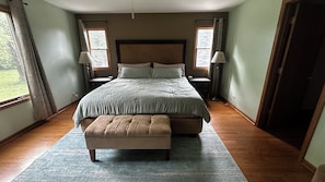 King bed with linens.