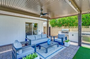 Enjoy shaded afternoons and breezy dinners under the covered patio, complete with a built-in BBQ grill.