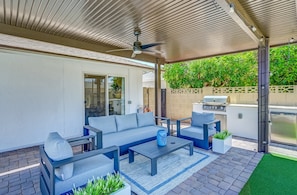 Enjoy shaded afternoons and breezy dinners under the covered patio, complete with a built-in BBQ grill.
