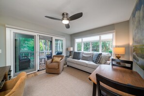 Cozy den on the 1st floor with desk and game table.