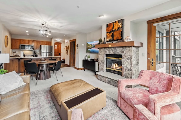 Living room: Pull-out sofa, gas fireplace, Smart TV, balcony access