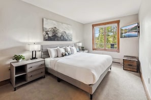Bedroom: King bed, en-suite bathroom, Smart TV, dresser, closet
