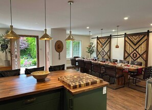 Tranquil, homey, open flow and to max dining/cooking w/family. Tables seats 12.