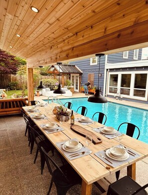 Enjoy cooking and dining poolside with a full outdoor kitchen and 12 seat table.