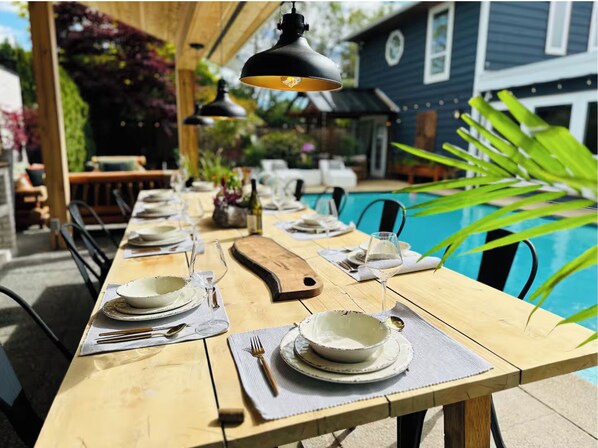 Enjoy cooking and dining poolside with a full outdoor kitchen and 12 seat table.