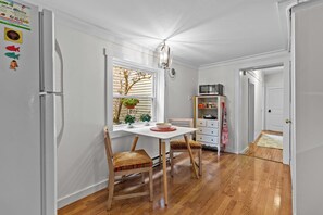 Dine with a view! This sunny kitchen corner is ideal for enjoying meals or simply planning your day's adventures.