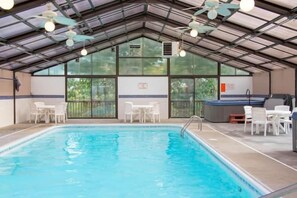 Enjoy year-round swimming in the expansive indoor pool, featuring a large hot tub for ultimate relaxation. The bright, airy space is perfect for family fun or unwinding after a day of activities.